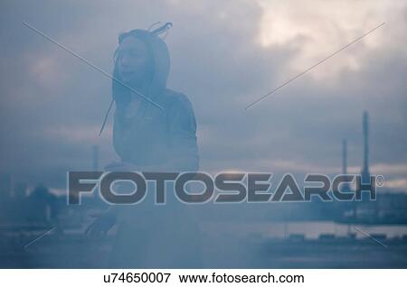 Young female runner running on misty stormy dockside View Large Photo Image Stock Photo - Young female runner running on misty stormy dockside. Fotosearch
