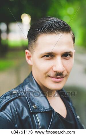 Stock Image - Young man with toothbrush moustache. Fotosearch