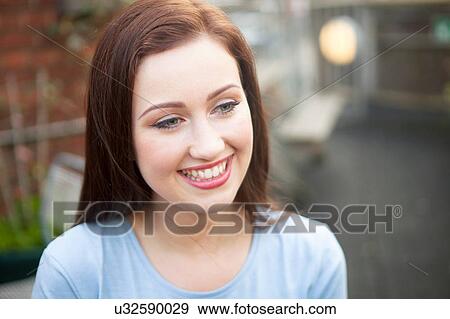 Young woman smiling View Large Photo Image Stock Photo - Young woman smiling. Fotosearch