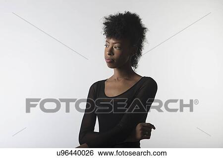 Stock Photograph - Young woman with arms crossed. Fotosearch
