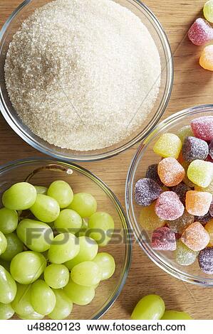 Bowls with sweets, grapes and sugar View Large Photo Image Stock Image - Bowls with sweets, grapes and sugar. Fotosearch