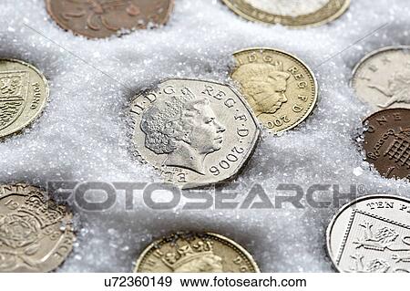 Coins in sugar View Large Photo Image Stock Photo - Coins in sugar. Fotosearch