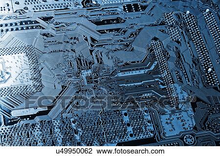 Stock Image - Computer microchips and resistors. Fotosearch