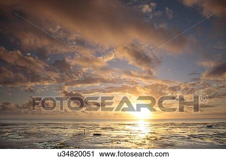 Dawn clouds and sunrise View Large Photo Image Stock Image - Dawn clouds and sunrise. Fotosearch