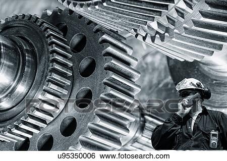Stock Photograph - Engineer with gears and cogs. Fotosearch