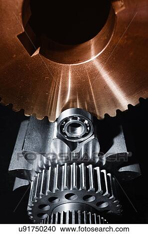 Stock Image - Gears and cogs with ball bearings. Fotosearch
