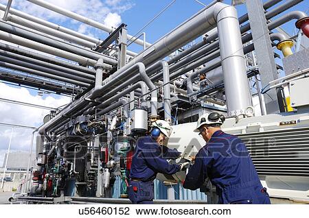 Industrial workers and oil pipes View Large Photo Image Stock Image - Industrial workers and oil pipes. Fotosearch