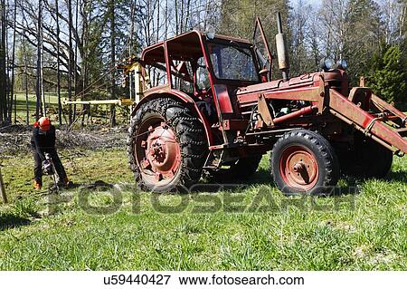 Lumberjack and tractor View Large Photo Image Stock Photo - Lumberjack and tractor. Fotosearch