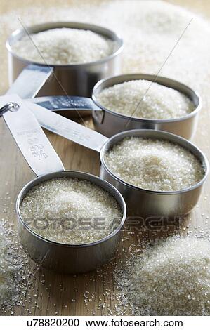 Measuring cups with sugar View Large Photo Image Stock Image - Measuring cups with sugar. Fotosearch