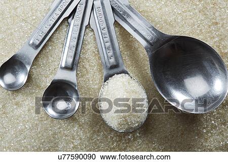 Measuring spoons with sugar View Large Photo Image Stock Image - Measuring spoons with sugar. Fotosearch
