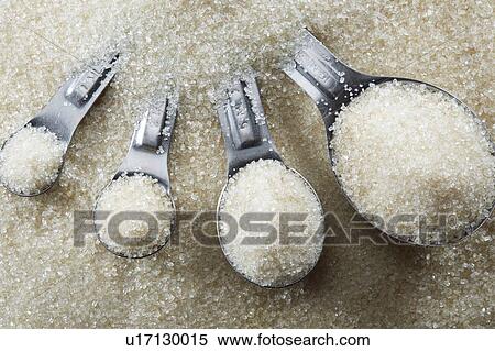 Measuring spoons with sugar View Large Photo Image Stock Photography - Measuring spoons with sugar. Fotosearch