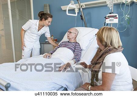 Nurse talking to senior man View Large Photo Image Stock Photography - Nurse talking to senior man. Fotosearch