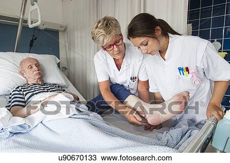 Nurses examining Patient View Large Photo Image Stock Image - Nurses examining Patient. Fotosearch