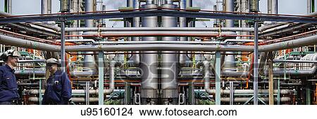 Oil and gas workers at petrochemical plant View Large Photo Image Picture - Oil and gas workers at petrochemical plant. Fotosearch
