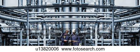 Oil and gas workers at petrochemical plant View Large Photo Image Stock Photograph - Oil and gas workers at petrochemical plant. Fotosearch