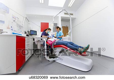 Stock Photo - Patient at dentist's. Fotosearch