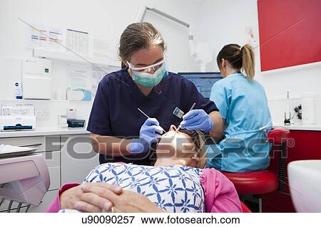 Stock Photo - Patient at dentist's. Fotosearch