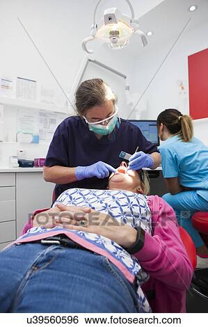 Stock Photograph - Patient at dentist's. Fotosearch