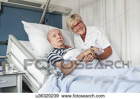 Stock Photo - Patient with female nurse. Fotosearch