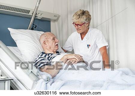 Patient with female nurse View Large Photo Image Stock Photograph - Patient with female nurse. Fotosearch