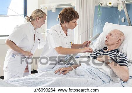Patient with nurses View Large Photo Image Picture - Patient with nurses. Fotosearch