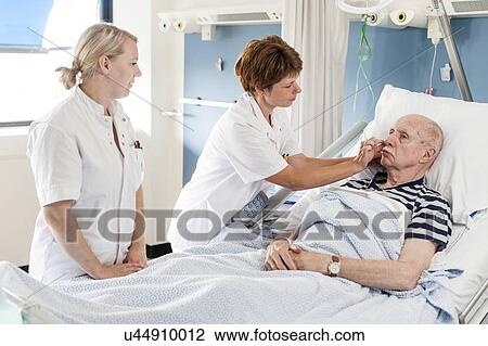 Patient with nurses View Large Photo Image Stock Image - Patient with nurses. Fotosearch