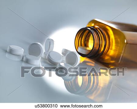 Pills spilling out of a bottle View Large Photo Image Stock Image - Pills spilling out of a bottle. Fotosearch