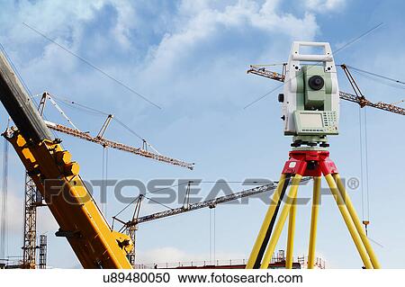 Surveying equipment on industrial site View Large Photo Image Stock Image - Surveying equipment on industrial site. Fotosearch