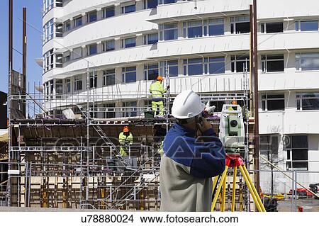 Picture - Surveyor working on construction site. Fotosearch