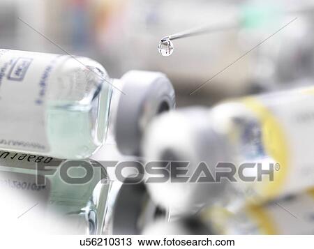 Stock Image - Syringe and vials. Fotosearch