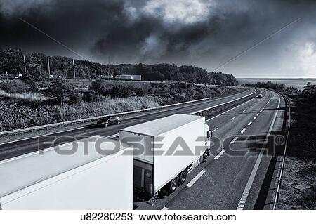 Trucks on highway View Large Photo Image Stock Image - Trucks on highway. Fotosearch