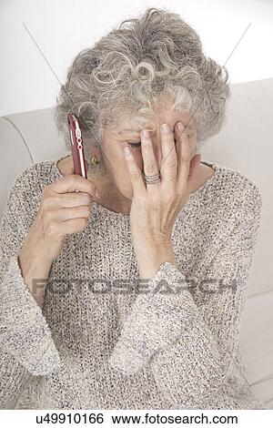 Woman receiving bad news on the phone View Large Photo Image Stock Photograph - Woman receiving bad news on the phone. Fotosearch