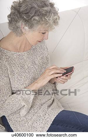 Woman using smartphone View Large Photo Image Stock Image - Woman using smartphone. Fotosearch