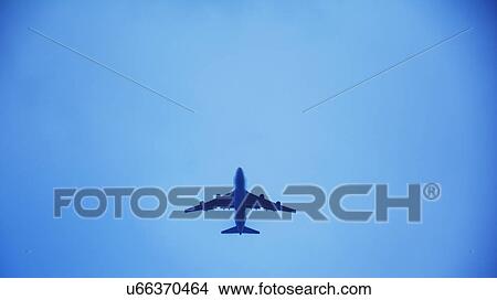 Airplane flying against clear sky View Large Photo Image Picture - Airplane flying against clear sky. Fotosearch