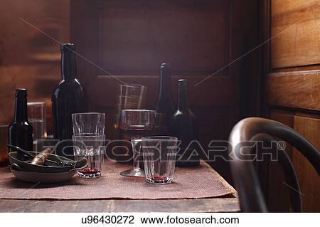 Stock Image - Beer bottles and glasses on table. Fotosearch