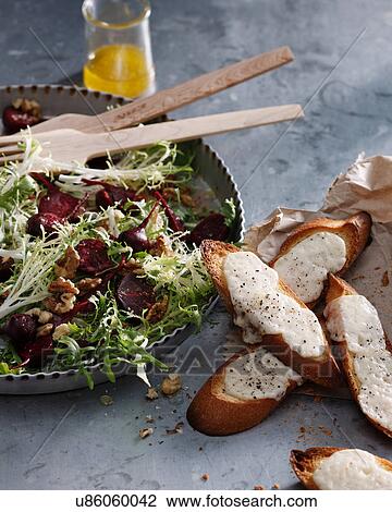 Stock Image - Beetroot, goats cheese and walnut salad with cheesy croutons. Fotosearch