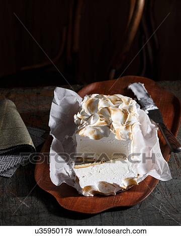 Bistro dessert of bombe alaska on table View Large Photo Image Stock Photo - Bistro dessert of bombe alaska on table. Fotosearch