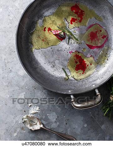 Stock Image - Bistro table with leftover beetroot, oil and horseradish in dish. Fotosearch