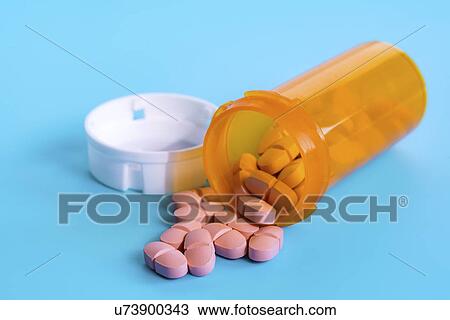 Stock Image - Bottle with capsules. Fotosearch