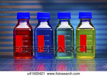 Bottles containing coloured liquid View Large Photo Image Stock Image - Bottles containing coloured liquid. Fotosearch