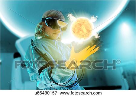 Boy in virtual reality headset interacting with digital floating sun View Large Photo Image Stock Photo - Boy in virtual reality headset interacting with digital floating sun. Fotosearch