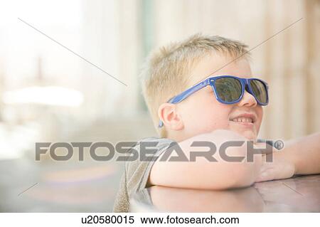 Boy resting on table View Large Photo Image Stock Photography - Boy resting on table. Fotosearch
