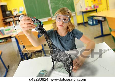 Boy with digital pen and 3D model of giraffe in classroom View Large Photo Image Picture - Boy with digital pen and 3D model of giraffe in classroom. Fotosearch