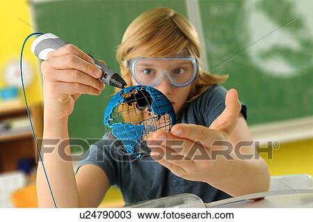 Boy with digital pen and 3D model of globe in classroom View Large Photo Image Stock Image - Boy with digital pen and 3D model of globe in classroom. Fotosearch