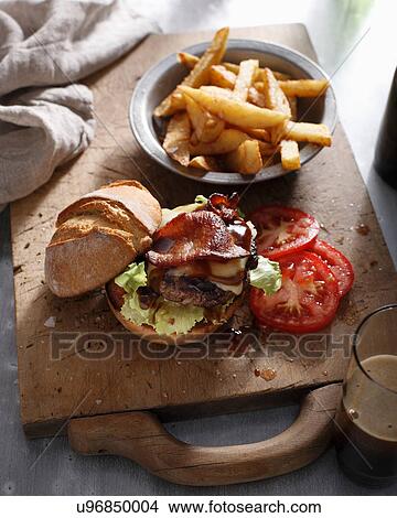 Burger with hand cut chips View Large Photo Image Picture - Burger with hand cut chips. Fotosearch