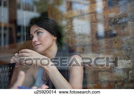 Businesswoman having meeting in coffee bar, London View Large Photo Image Picture - Businesswoman having meeting in coffee bar, London. Fotosearch