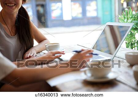 Businesswomen having meeting in coffee bar, London View Large Photo Image Stock Image - Businesswomen having meeting in coffee bar, London. Fotosearch