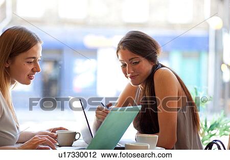 Businesswomen having meeting in coffee bar, London View Large Photo Image Stock Image - Businesswomen having meeting in coffee bar, London. Fotosearch