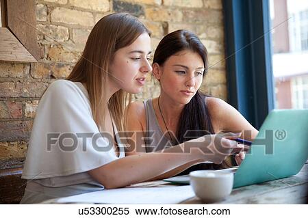 Businesswomen having meeting in coffee bar, London View Large Photo Image Stock Photography - Businesswomen having meeting in coffee bar, London. Fotosearch