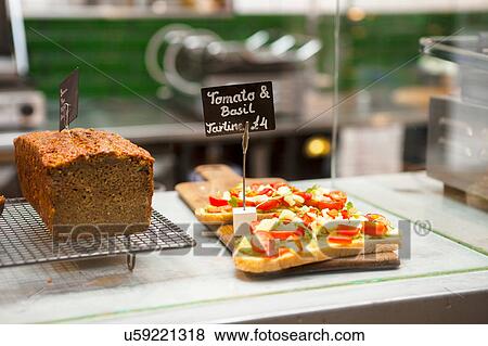 Stock Photo - Cafe display cabinet with cake and open sandwiches. Fotosearch